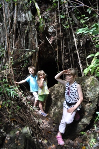 Lucas, Aurelia, and Isabella acting the explorer about to enter a Waimano water cave